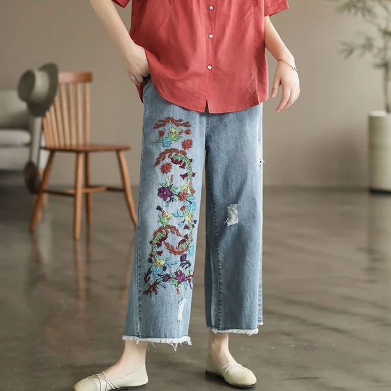 Woman with Sweatshirt and Torn Trousers Sitting on the Street Stock Photo |  Adobe Stock